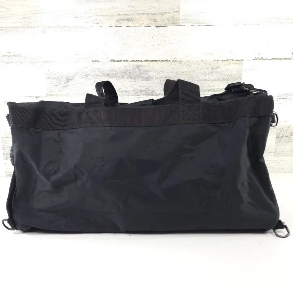 VINTAGE HARLEY DAVIDSON AN AMERICAN LEGEND BLACK DUFFLE BAG WITH SHOULDER STRAP.